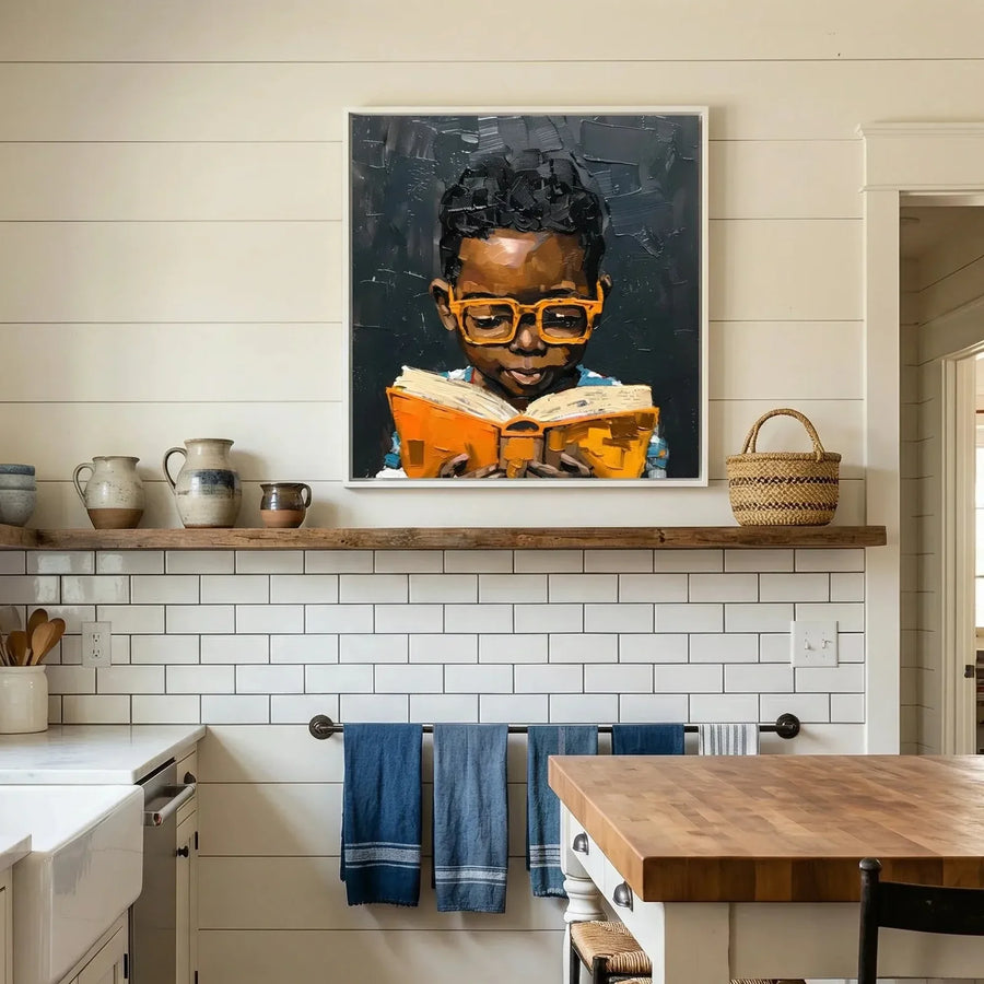 African American kitchen canvas in farmhouse kitchen with shiplap and apron sink, Black boy in orange glasses reading. Digital mockup.