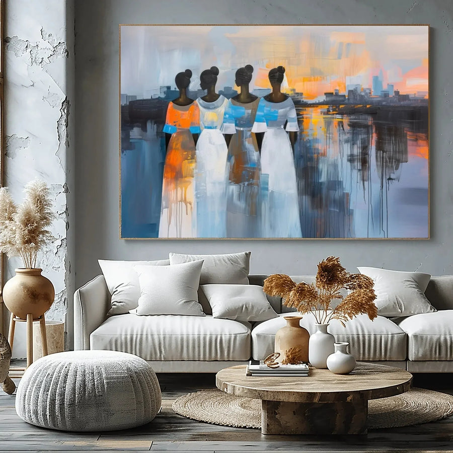 Urban Black aesthetic wall art in industrial living room with concrete walls and pampas, four Black women at sunset, abstract. Digital mockup.