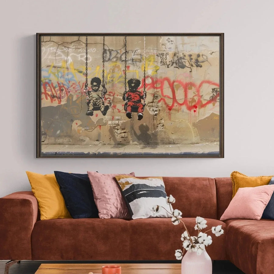 Black art for living room in warm scandi space with cognac sectional and pink pillows, Black boys on swings stencil. Digital mockup.