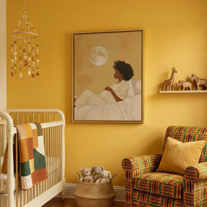 Black art for nursery walls in sunny yellow nursery with kente chair and African animals, pregnant Black woman art. Digital mockup.