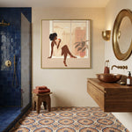 Black woman canvas wall art in bathroom with Moroccan style bathroom with navy tile shower, copper vessel sink, patterned. Digital mockup.