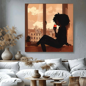 Afrohemian home decor wall art in boho living room with mudcloth pillows and brass tray, Black woman wine silhouette. Digital mockup.