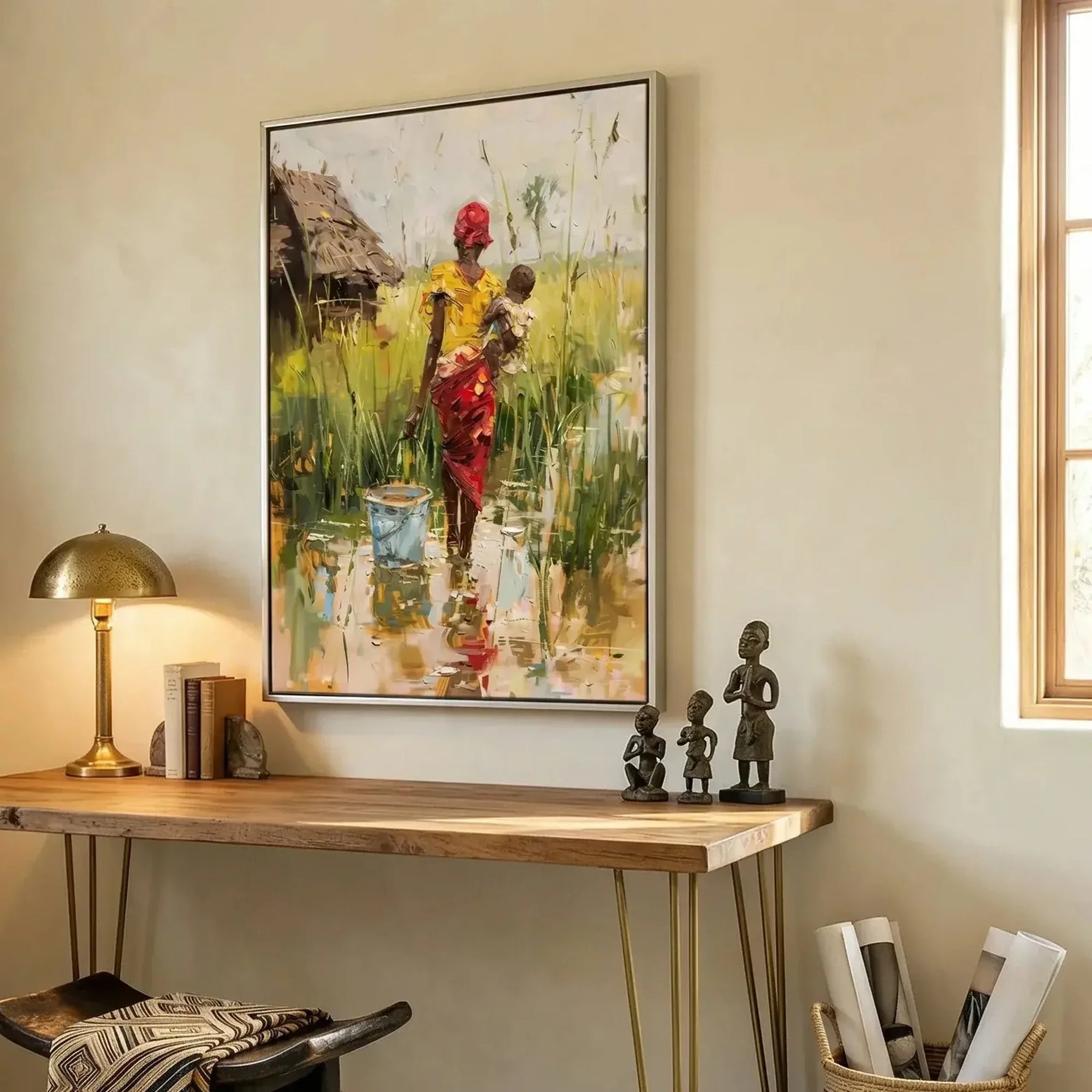 Black home office art in modern home office with walnut console and African statues, African woman with baby in village. Digital mockup.