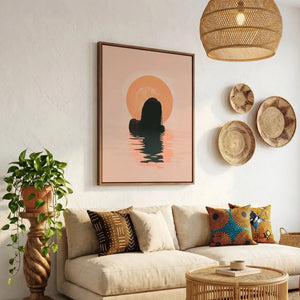 Black art for living room in boho space with cream sectional and rattan coffee table, Black woman swimming at sunrise. Digital mockup.