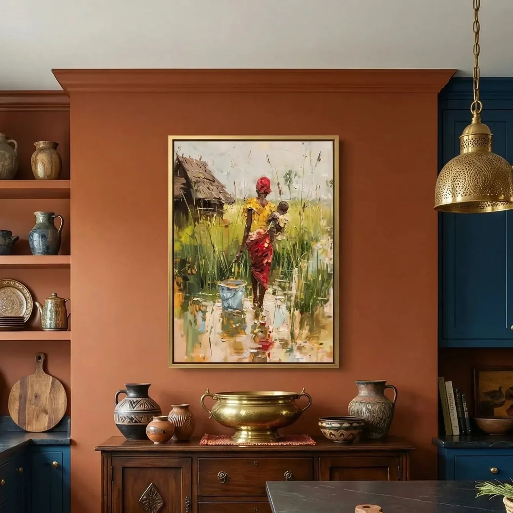 Afrohemian home decor wall art in eclectic kitchen with terracotta wall and navy cabinets, African woman with baby in village. Digital mockup.