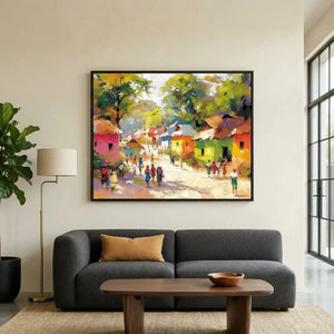 African landscape paintings in modern living room with charcoal sofa and fiddle leaf, colorful African village scene painting. Digital mockup.