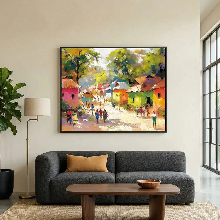 African landscape paintings in modern living room with charcoal sofa and fiddle leaf, colorful African village scene painting. Digital mockup.