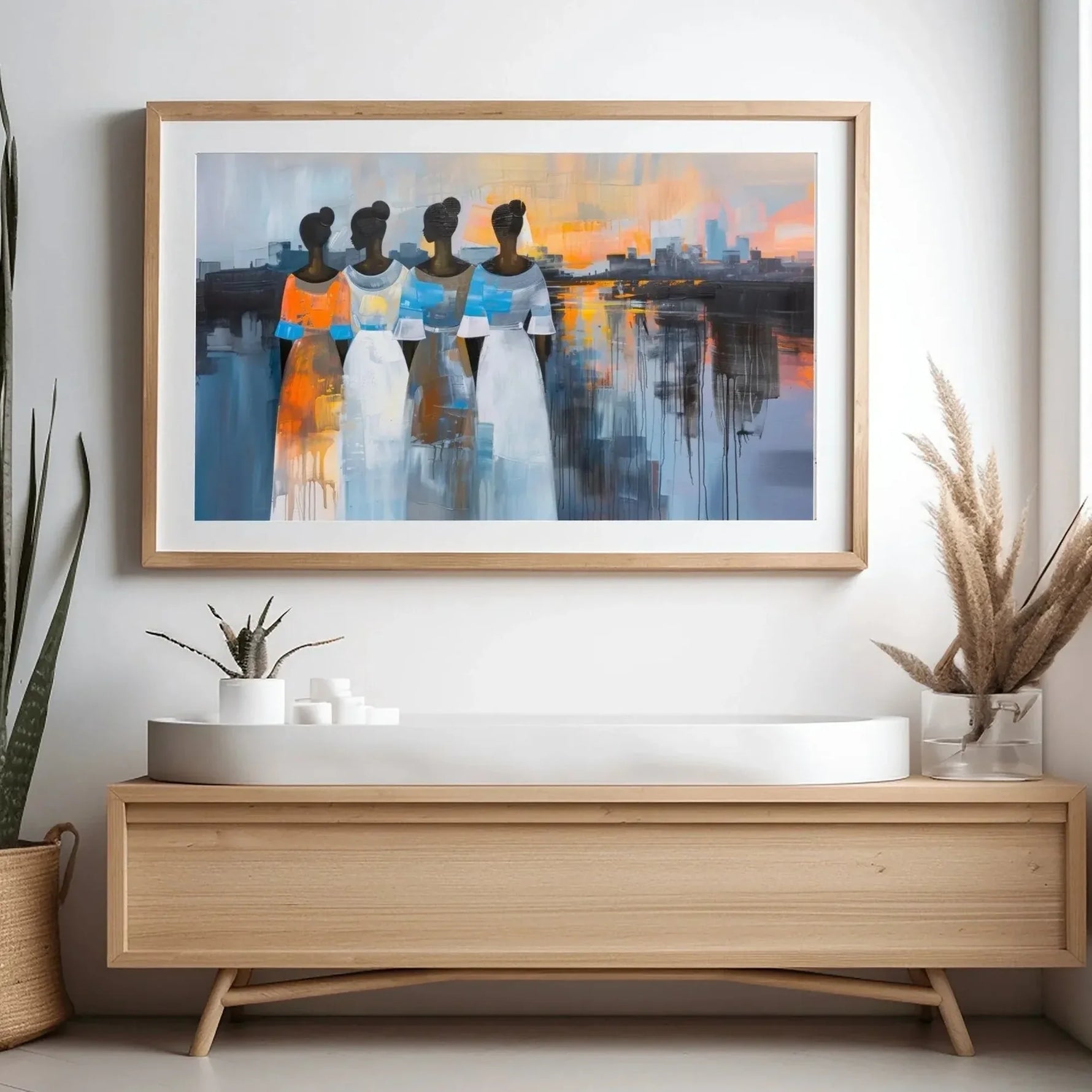 Modern Black art for apartment in scandi hallway with light wood console and snake plant, four Black women at sunset. Digital mockup.
