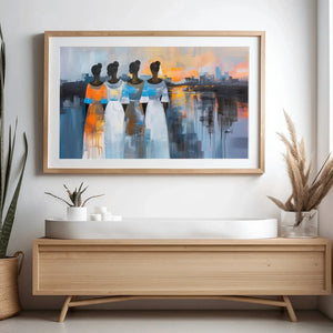 Modern Black art for apartment in scandi hallway with light wood console and snake plant, four Black women at sunset. Digital mockup.