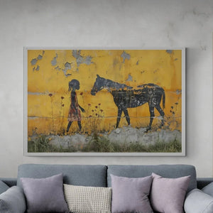 Urban Black aesthetic wall art in modern living room with gray sectional and concrete walls, Black girl with horse, stencil. Digital mockup.